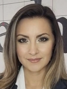 A close-up image of Arianna Becerril García, showing her in a black blazer with long hair.